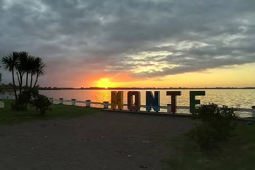 Monte sign by the lagoon at sunset